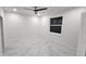 Bright, airy bedroom featuring stylish floors, recessed lighting, a modern ceiling fan, and a window at 1240 Solitude Ln, Sarasota, FL 34242