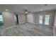 Bright bedroom with wood floors, double closets, and French doors leading to the patio at 1240 Solitude Ln, Sarasota, FL 34242