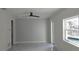 Bedroom featuring fresh paint, neutral tile floors, a ceiling fan and an outdoor swimming pool view at 1240 Solitude Ln, Sarasota, FL 34242