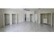 Bright bedroom with built-in closet systems, stylish tile floors, and lots of storage at 1240 Solitude Ln, Sarasota, FL 34242