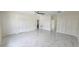 Expansive bedroom boasting sleek tile floors, ample closet space, and abundant natural light at 1240 Solitude Ln, Sarasota, FL 34242