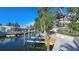 Private dock with boat lift access, perfect for waterfront living and enjoying boating activities at 1240 Solitude Ln, Sarasota, FL 34242
