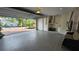 Clean, well-lit garage with an epoxy floor, laundry hookups, and storage space at 1240 Solitude Ln, Sarasota, FL 34242