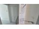 Hallway with stylish lighting fixture and modern railings with white marble flooring at 1240 Solitude Ln, Sarasota, FL 34242