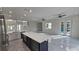 Open-concept living space with high ceilings, tile flooring, and access to the pool area at 1240 Solitude Ln, Sarasota, FL 34242