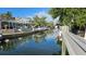 Scenic waterfront canal view, complete with boat dock, for easy access to aquatic adventures at 1240 Solitude Ln, Sarasota, FL 34242