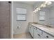 Bright bathroom featuring walk in shower, and double vanity at 13422 Saw Palm Creek Trl, Lakewood Ranch, FL 34211