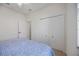 Cozy bedroom featuring a ceiling fan and closet at 13422 Saw Palm Creek Trl, Lakewood Ranch, FL 34211