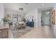 Bright dining area features a round table with neutral accents and bright, natural light at 13422 Saw Palm Creek Trl, Lakewood Ranch, FL 34211