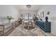 Dining area features a round table, stylish decor, and a decorative rug at 13422 Saw Palm Creek Trl, Lakewood Ranch, FL 34211