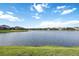 Waterfront view of lake surrounded by homes at 13422 Saw Palm Creek Trl, Lakewood Ranch, FL 34211
