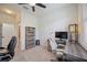 Bright office space with multiple desks, white rolling chair, bookcase and ceiling fan at 13422 Saw Palm Creek Trl, Lakewood Ranch, FL 34211