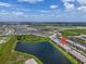 Aerial view of Primary-planned community nestled near a pond at 15131 Sunny Day Dr, Bradenton, FL 34211