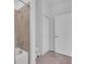 Bathroom with a shower/tub, white tile surround, and modern fixtures at 15131 Sunny Day Dr, Bradenton, FL 34211
