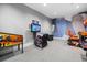 Indoor arcade featuring a variety of video games and colorful wall decor at 15716 Barefoot Beach Dr, Bradenton, FL 34211