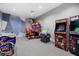 An indoor arcade with multiple video games and colorful murals at 15716 Barefoot Beach Dr, Bradenton, FL 34211