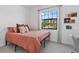 Cozy bedroom with a bright window, offering a relaxing space at 15716 Barefoot Beach Dr, Bradenton, FL 34211