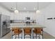 Bright kitchen featuring stainless steel appliances, granite countertops, and a large island with seating at 15716 Barefoot Beach Dr, Bradenton, FL 34211