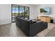 Comfortable living room with large-screen TV and access to the screened outdoor living space at 15716 Barefoot Beach Dr, Bradenton, FL 34211
