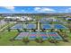Overhead view of the community's well-maintained tennis courts, perfect for residents to enjoy a match at 15716 Barefoot Beach Dr, Bradenton, FL 34211