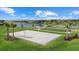 Outdoor volleyball court and bocce ball adjacent to community amenities, perfect for outdoor activities and socializing at 15716 Barefoot Beach Dr, Bradenton, FL 34211