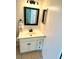Bathroom with a vanity, and a dark-framed mirror at 1604 Chevy Chase Dr, Sun City Center, FL 33573
