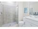 Clean, bright bathroom featuring glass shower doors and white vanity with silver hardware at 17612 Northwood St, Lakewood Ranch, FL 34202