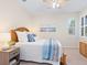 Comfortable bedroom featuring a ceiling fan and bright window with shutter style blinds at 17612 Northwood St, Lakewood Ranch, FL 34202