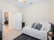 Spacious bedroom featuring ceiling fan, a double door entry and neutral decor and furnishings at 17612 Northwood St, Lakewood Ranch, FL 34202