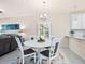 Cozy dining area featuring a round table, stylish chairs, and a modern chandelier at 17612 Northwood St, Lakewood Ranch, FL 34202