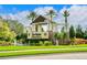The community entrance displays manicured landscaping, fountains, and the Del Webb Lakewood Ranch sign at 17612 Northwood St, Lakewood Ranch, FL 34202