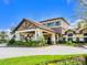 A beautifully landscaped community center featuring stone and stucco architecture with manicured greenery at 17612 Northwood St, Lakewood Ranch, FL 34202