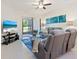Comfortable living room with neutral tones, access to the patio, and a modern television at 17612 Northwood St, Lakewood Ranch, FL 34202