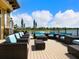 Inviting outdoor lounge area with comfortable seating and scenic views of the lake and landscaping at 17612 Northwood St, Lakewood Ranch, FL 34202