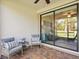 Covered patio with brick flooring and comfortable seating, perfect for outdoor relaxation at 17612 Northwood St, Lakewood Ranch, FL 34202