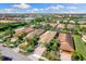 Aerial view showcases the beautiful community, with stunning lakes, lush landscaping, and well-maintained homes at 19023 Mangieri St, Venice, FL 34293