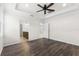 Bedroom with wood floors and two doors, one leading into the bathroom at 19023 Mangieri St, Venice, FL 34293
