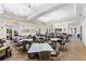 Large dining area with tables and chairs set up, ideal for hosting gatherings and events for the community at 19023 Mangieri St, Venice, FL 34293