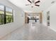 Open-concept kitchen showcasing white cabinets and a center island at 19023 Mangieri St, Venice, FL 34293