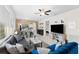 Comfortable living room with neutral tile, open kitchen, and modern decor at 19023 Mangieri St, Venice, FL 34293