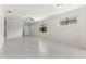 Inviting living area with tile floors, natural light, and a ceiling fan at 19023 Mangieri St, Venice, FL 34293