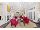 Elegant lounge area with a fireplace, plush seating, and stylish decor, perfect for socializing and relaxation at 19023 Mangieri St, Venice, FL 34293