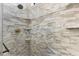 Beautifully tiled shower with built-in shelves and modern fixtures at 19023 Mangieri St, Venice, FL 34293