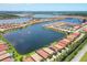 Expansive aerial view showcases a residential community with multiple lakes and well-maintained homes at 201 Vinadio Blvd, Nokomis, FL 34275