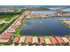 Scenic aerial view captures a residential community with a large lake and neatly arranged houses at 201 Vinadio Blvd, Nokomis, FL 34275