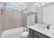 Well-lit bathroom featuring a shower-tub combo and a modern vanity at 201 Vinadio Blvd, Nokomis, FL 34275