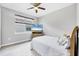Cozy bedroom with light wood floors and a bright window at 201 Vinadio Blvd, Nokomis, FL 34275