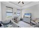 Bright Bedroom with crib, changing table, and ample natural light at 201 Vinadio Blvd, Nokomis, FL 34275