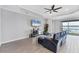 Inviting living room with tile floors, fan, lake view and comfortable seating at 201 Vinadio Blvd, Nokomis, FL 34275