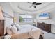Main bedroom with a view of the lake, offering a tranquil retreat at 201 Vinadio Blvd, Nokomis, FL 34275